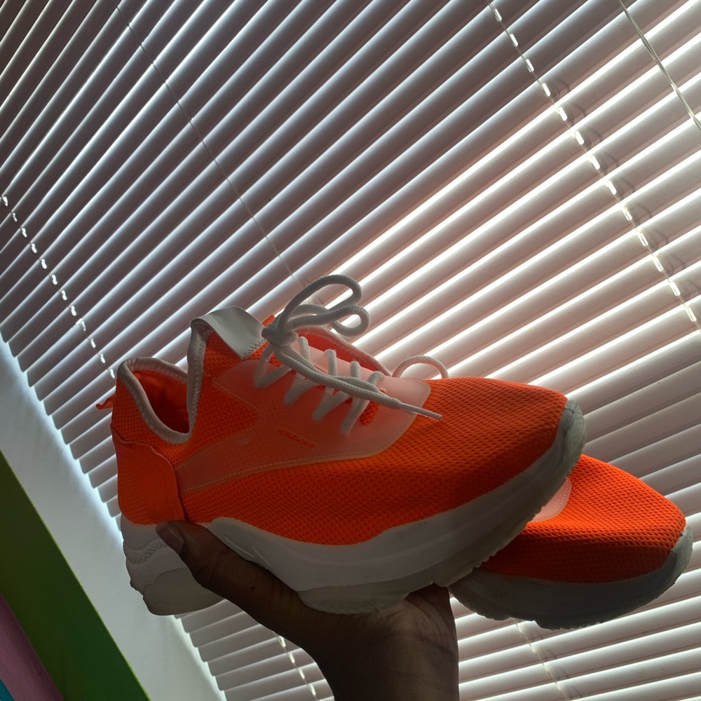 Orange athletic shoes